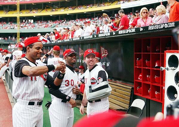 Photo of Barry Larkin and Ken Griffey Jr. in the Cincinnati Reds Dugout at Cinergy Field.