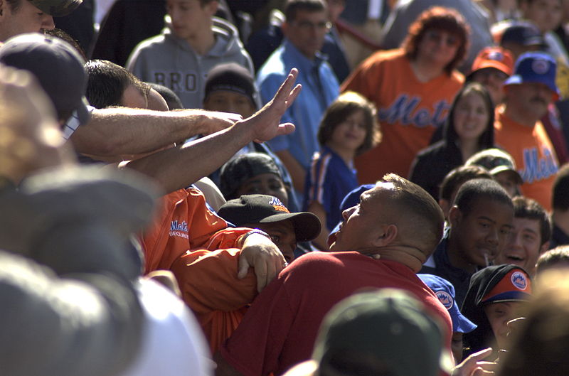 Photo of a group of fans fighting at a Major League Baseball game.