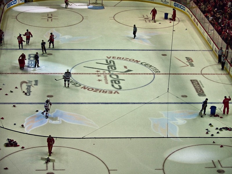 Photo of a Washington Capitals game at Capital One Arena during a hat trick cleanup.