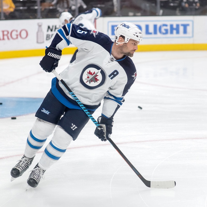 Photo of Mark Stuart of the Winnipeg Jets skating on the ice.