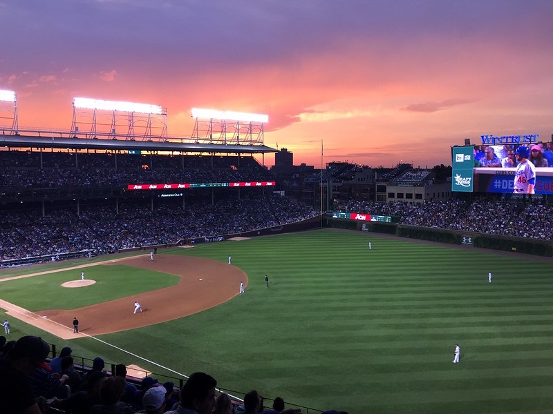 Photo of a Chicago Cubs game at Wrigley Field at night.