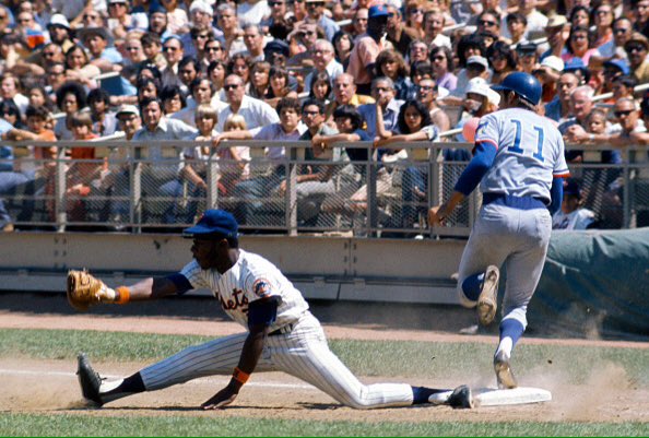 Photo of New York Mets first baseman John Milner making a play at 1st base at Shea Stadium.